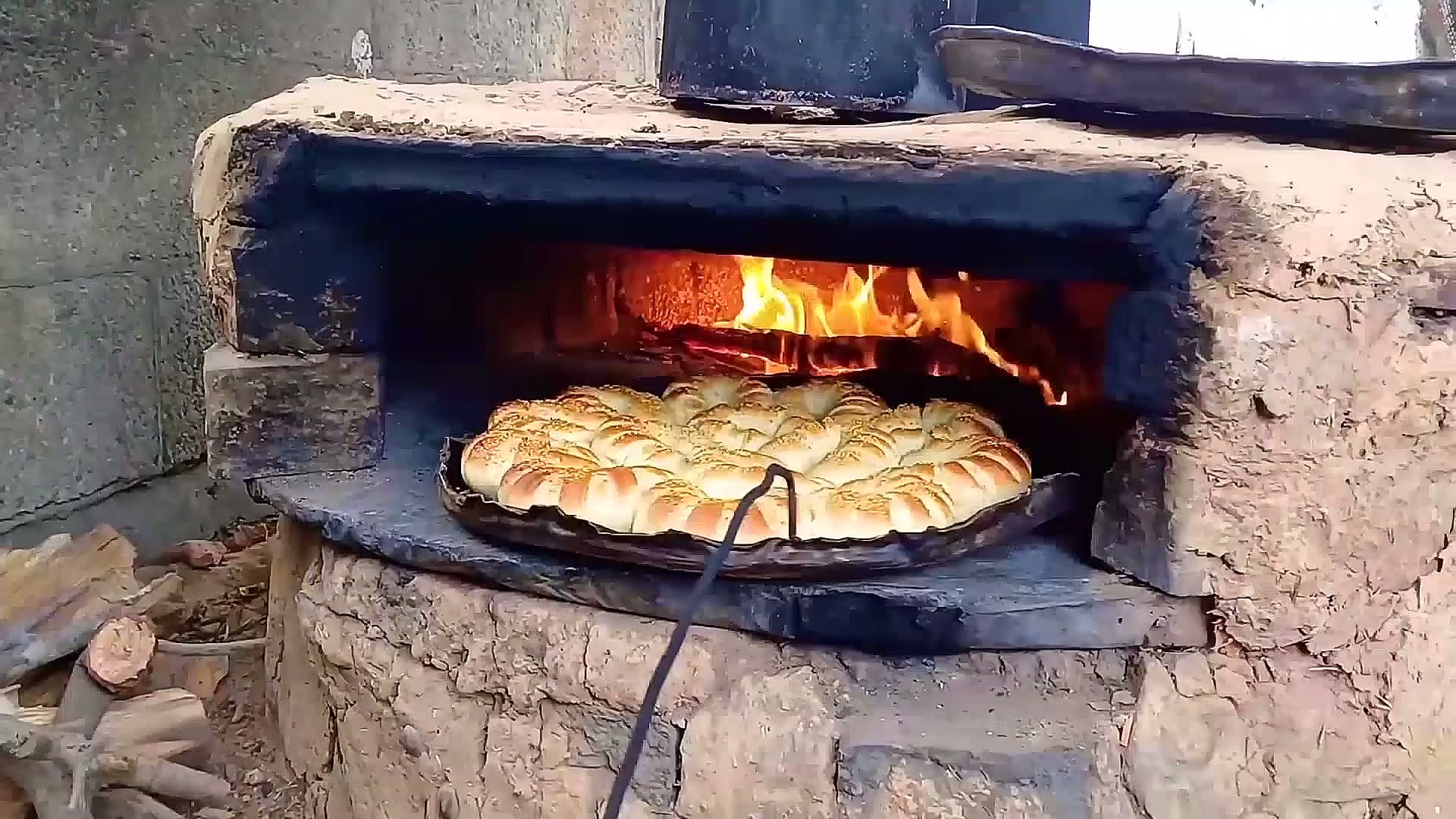 Bread baking in a home-built oven at the Theatre Day Productions tent camp in Gaza